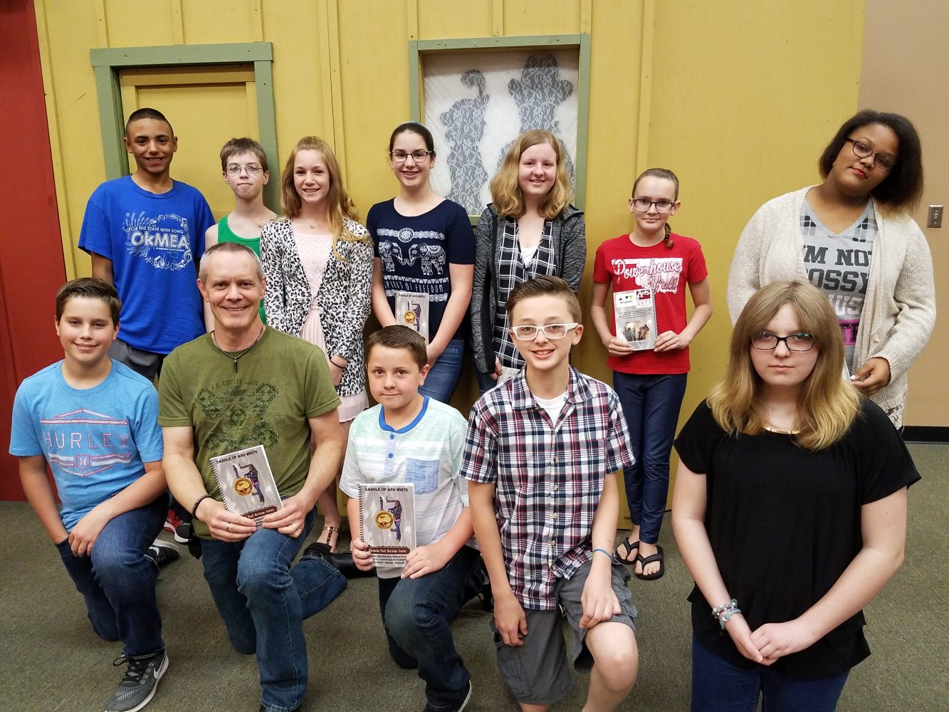 Duncan Middle School sixth-graders participated in a writing program at the Chisholm Trail Heritage Center. Those pictured with OU professor Nathan Brown include, front row from left, Drew Cook, Brown, Jordan Talley, Bryce Chambless, Autumn Boyles; back row: Cullen Stevens, Bradley Hill, Sheridan White, Sophia Marsh, Bryanna Smith, Ariiana Montoya and Alson Cartwright.