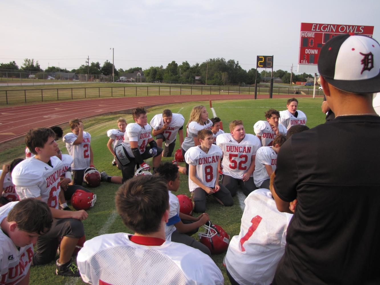 DMSs seventh-grade football players meet prior to Tuesdays game.
