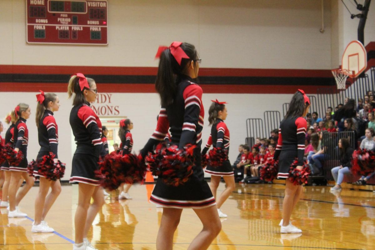 DMS cheerleaders kick off the pep rally for fall sports.