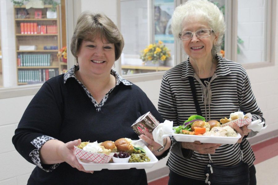 Sherry McGhghy shows off the Thanksgiving lunch featured in the cafeteria Thursday.