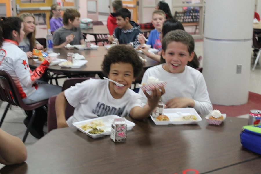 Duncan Middle School sixth-graders eat food served in the Thanksgiving tradition.