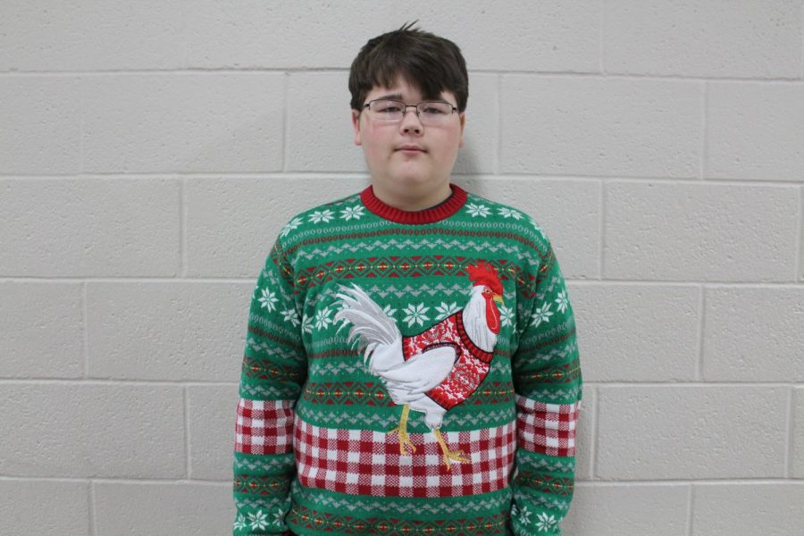 Landen Mowdy shows just how different Christmas sweaters can be with his rooster-based shirt.