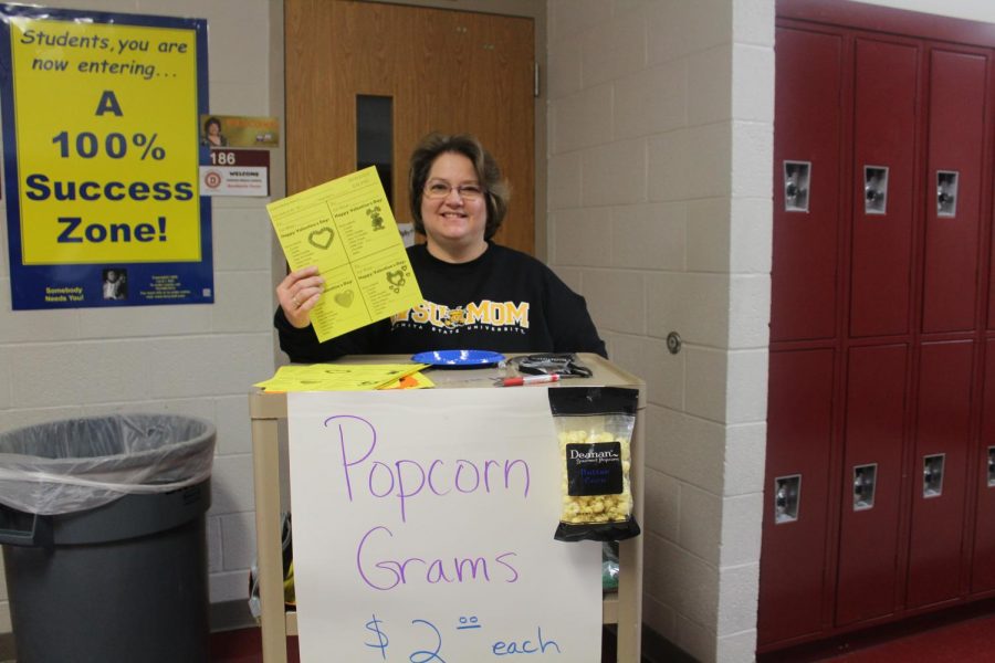 Sherry McGhghy shows off the popcorn grams. Today is the last day to order.