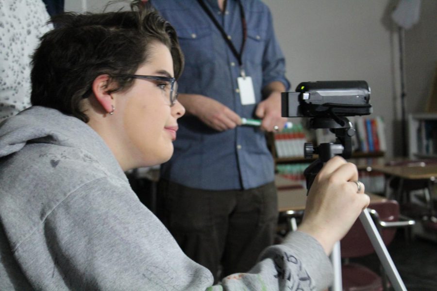 Acacia Luke sets up the camcorder for Wednesdays Broadcast Club video.