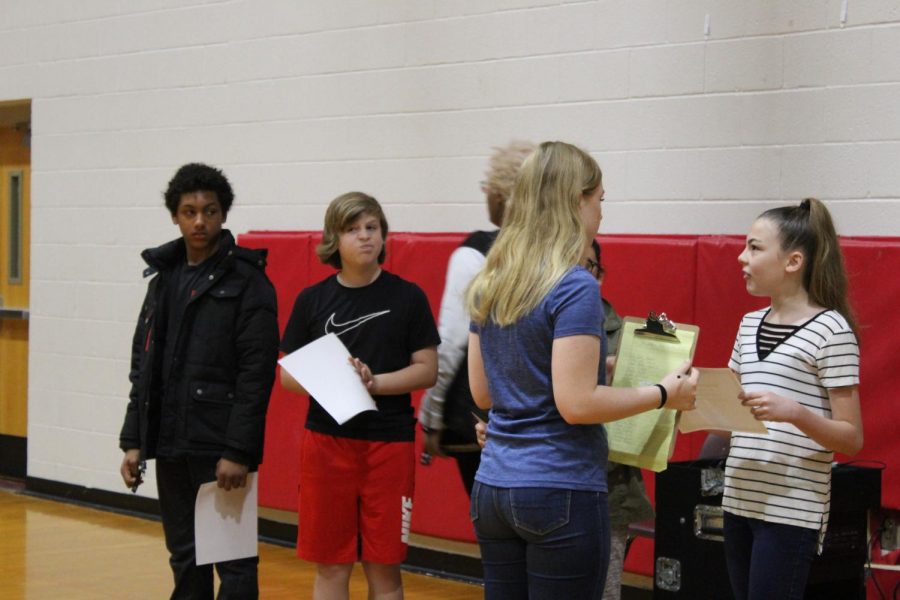 Katie Presgrove talks with March sixth-grade students of the month.