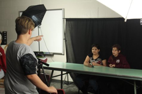 Ayden Heidler directs Ailana Hall-Satoe and Alex Stevens during Wednesdays Broadcast Club meeting.