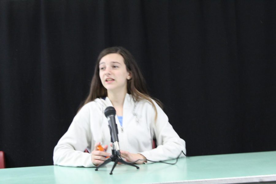 Grace Dean practices her podcasting skills during a Broadcast Club meeting.