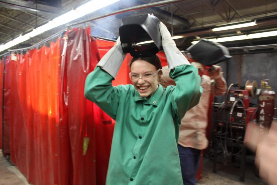 Jaycie Meadows takes off the welding mask at Red River Technology Center.