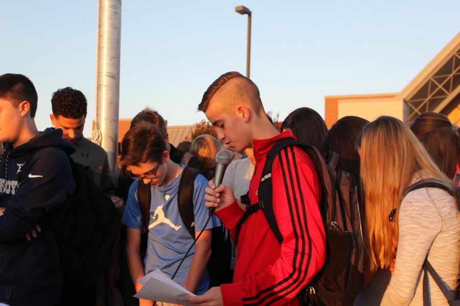 Students pray together during Wednesdays See You at the Pole event.