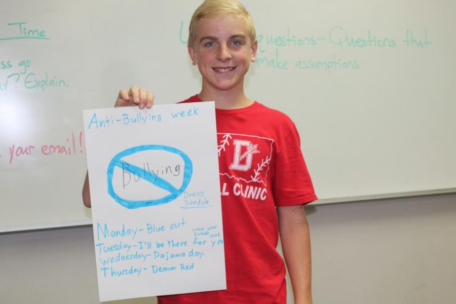 Cannon Brenneis shows off the poster he made for Anti-Bullying Week.