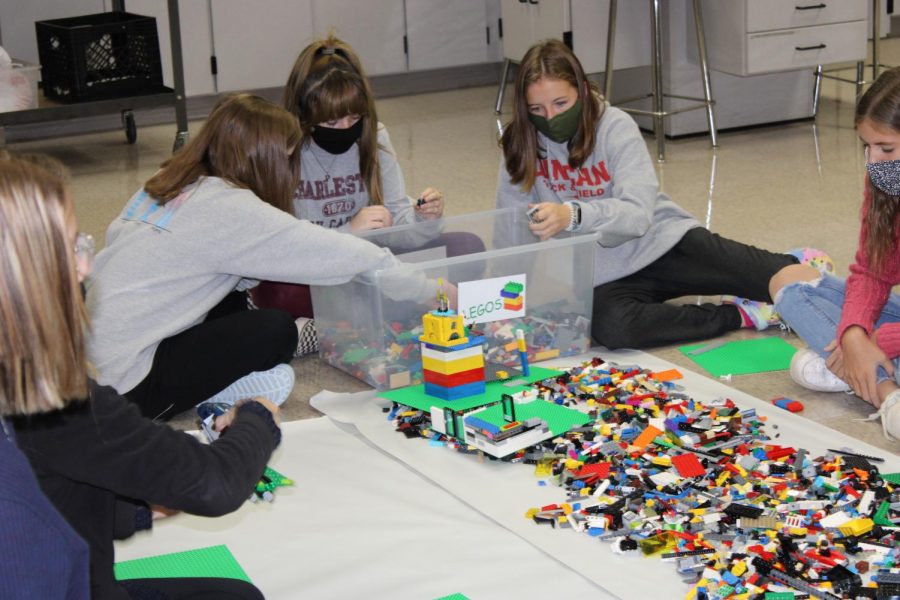 Eighth-grade students use Legos to design a prototype during Education Station.