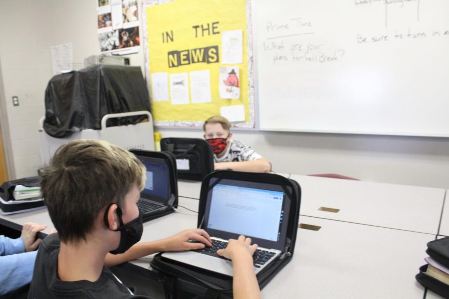 Sixth-grade students Riley Hutton and Jace Jackson work on an assignment as part of Digital Day. Today is the last day of school before Fall Break.