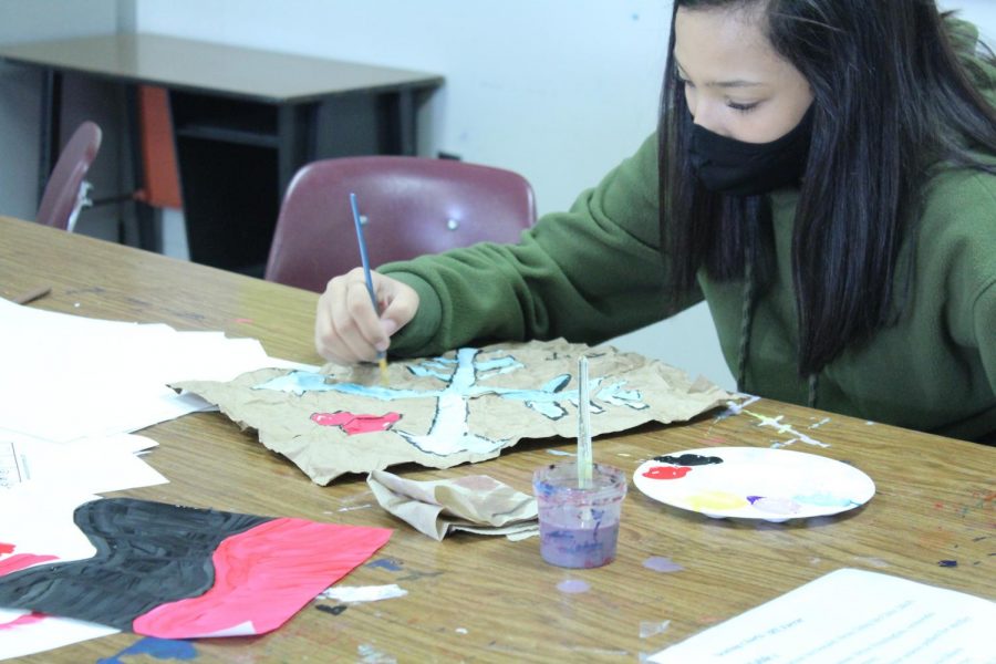 Art students work on pictographs as their latest art project.