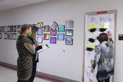 Barbra Davis, Barbara Gee and Cathy Barker judge Sonia Norton's classroom door for the Red Ribbon Week door decorating contest.