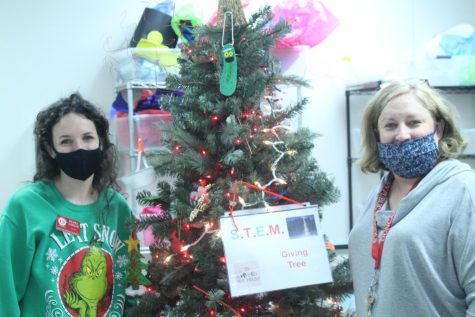 Renea Lawler and Rosie Castle show off the STEM Giving Tree.
