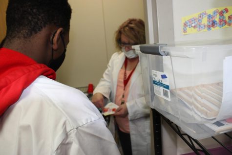 Rosie Castle talks with a STEM student during class.