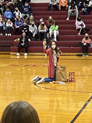 Ava Miller shows what kinds of food goes into the usual Supper Club bag. The National Junior Honor Society is hosting a food drive to help the DMS food pantry.