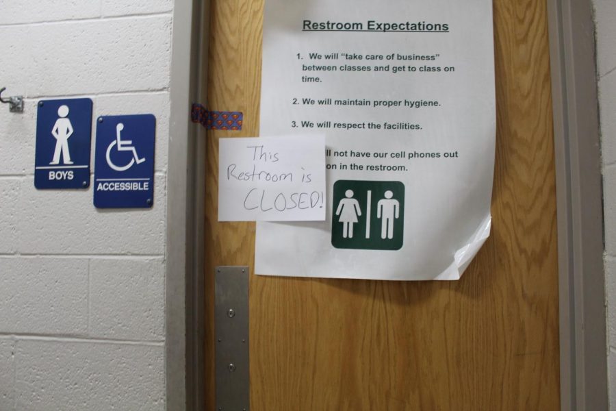 A sign on the seventh-grade boys restroom shows 