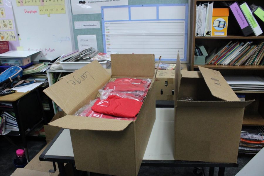 many Student Council Shirts in boxes in Sonia Nortons classroom