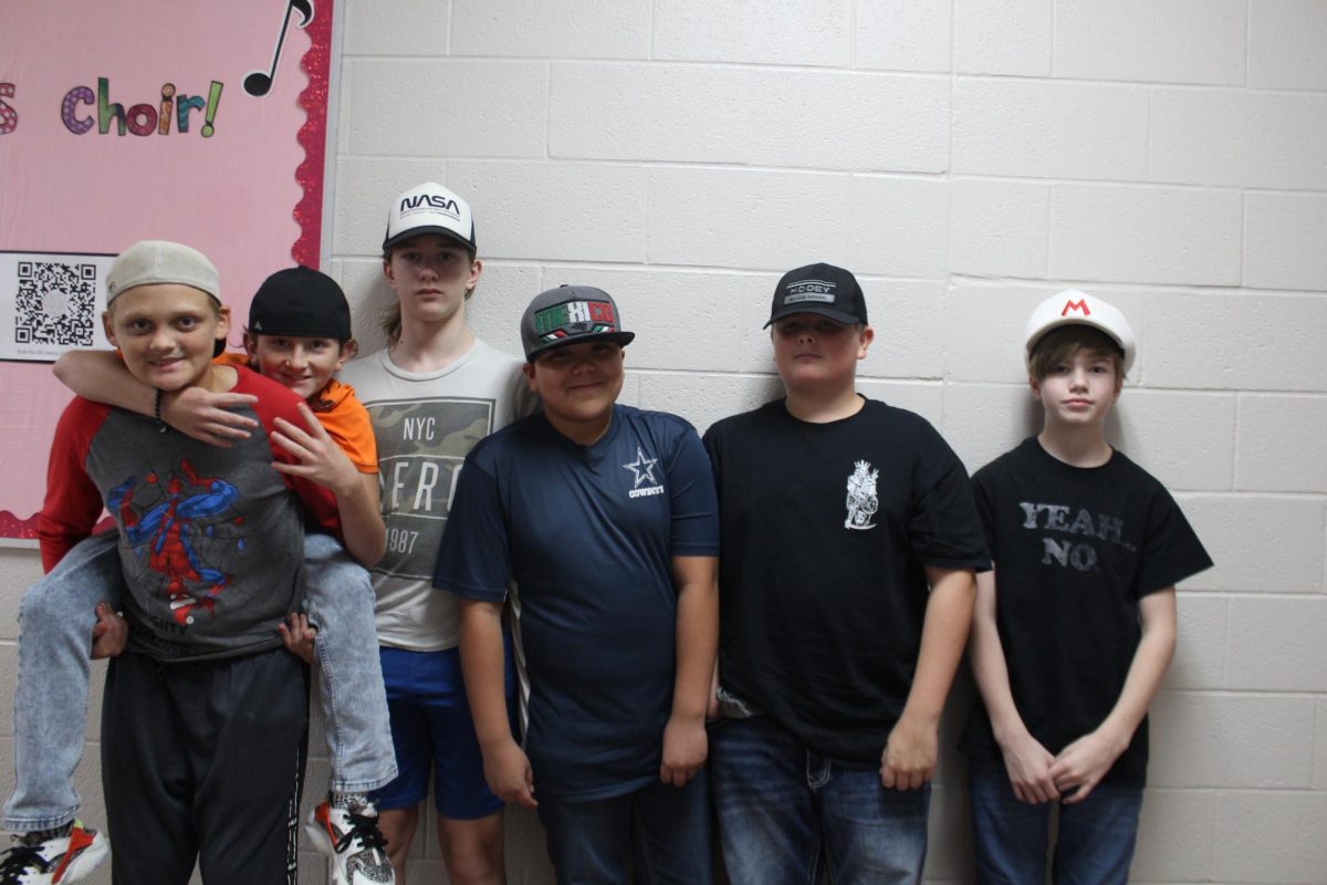 Duncan Middle School students participate in a back-to-school dress-up week in August. Collin Quinn, far right, wore a Mario Bros. hat for the dress-up day. Quinn has started a paper hat revolution in hopes of overturning the schools ban on hats, outside of spirit days.