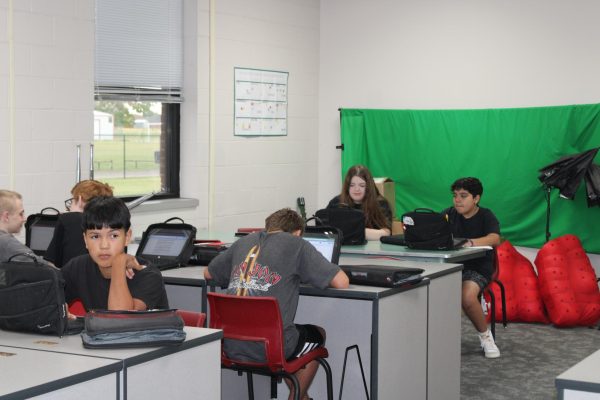 The Demon Direct staff works on various news stories during the second hour newspaper class.