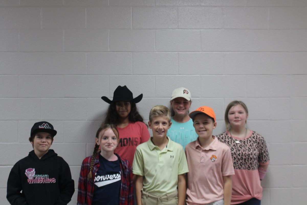 Students show off their country club or country sides during the first dress-up day of homecoming week.