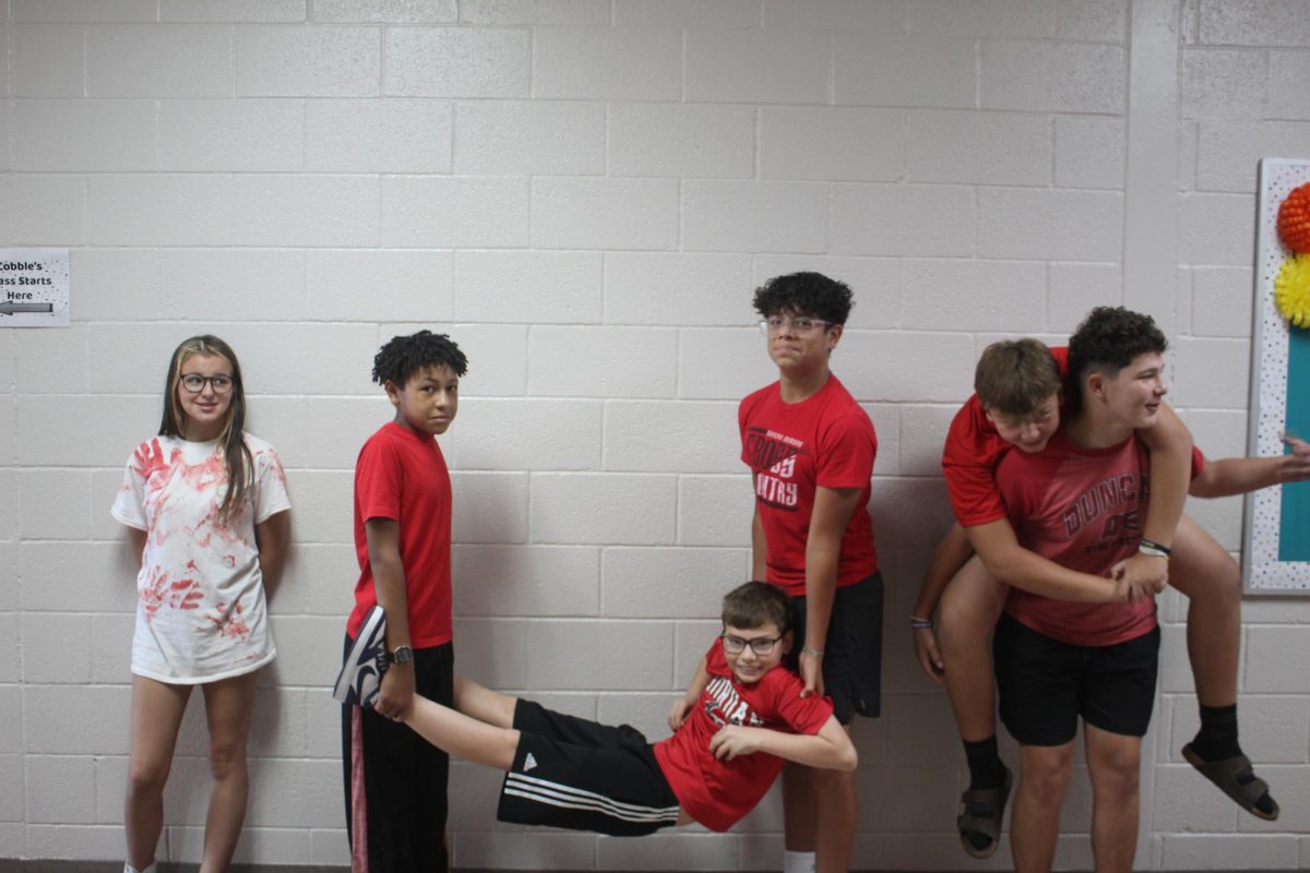 Eighth-graders show off their silly side on the latest Fans Wear Red Friday.