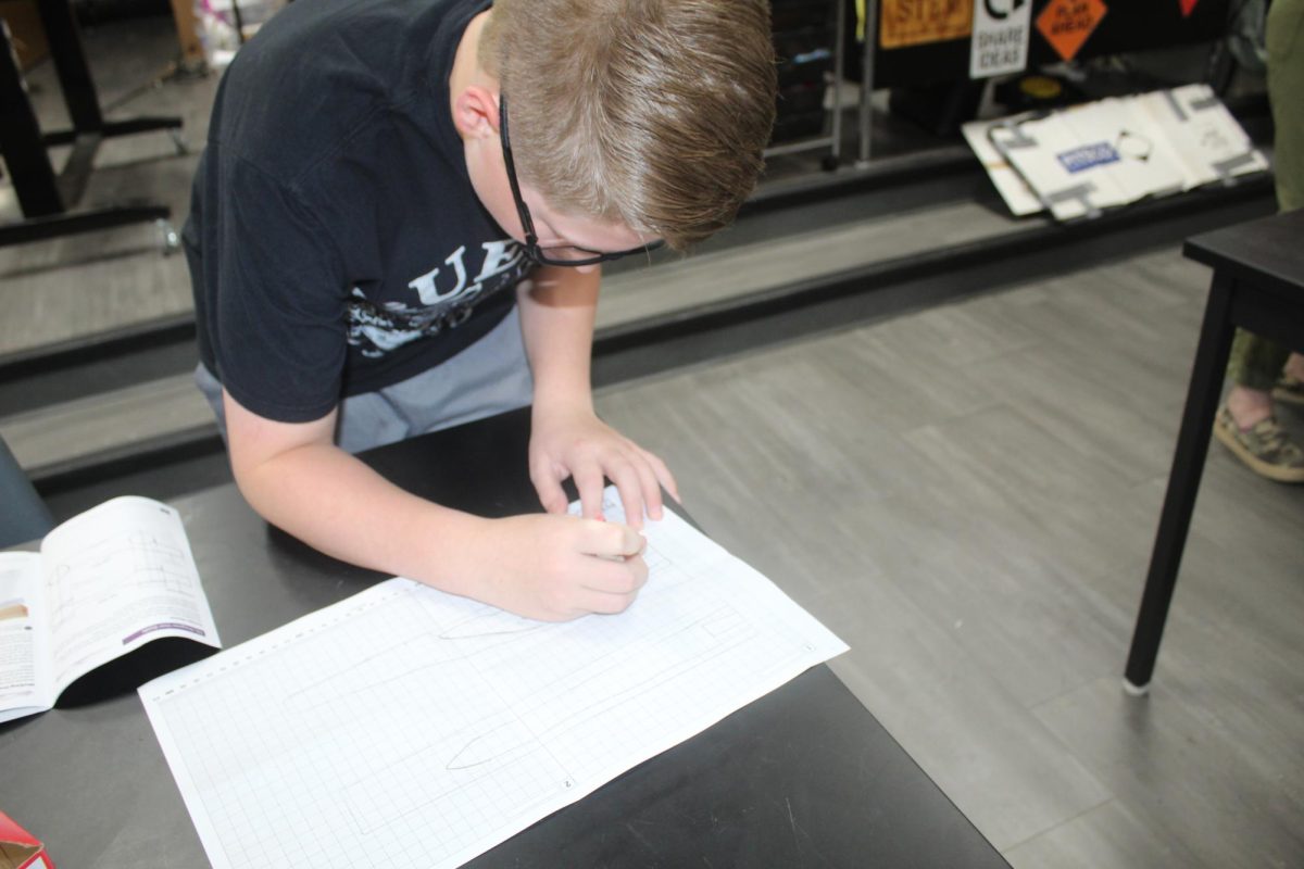 Trent Livingston works on a design for his CO2 car today.