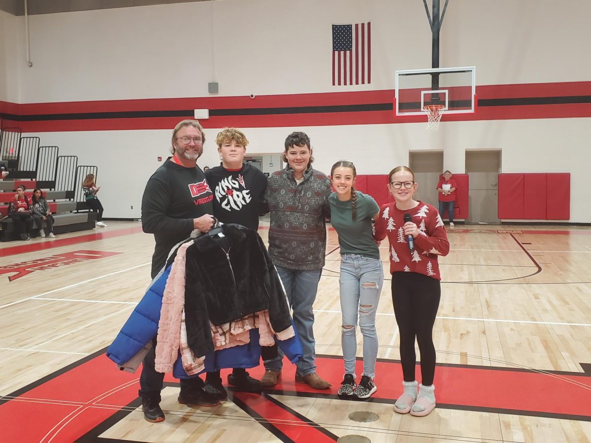 Student Council does coat drive with Bubba Clark.