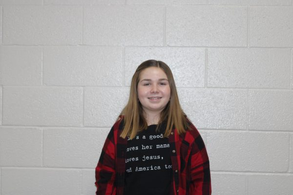 8th grader, Lily Thomas, poses for a picture.