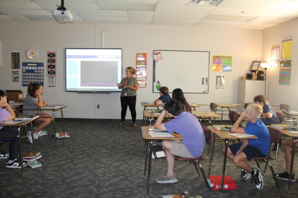 Marinda Cook, sixth-grade math, teachers her students during class today.