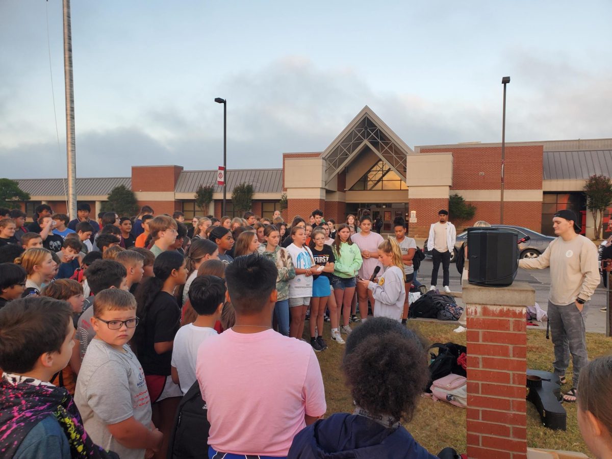 Students gathered around the flagpole for See you at the Pole