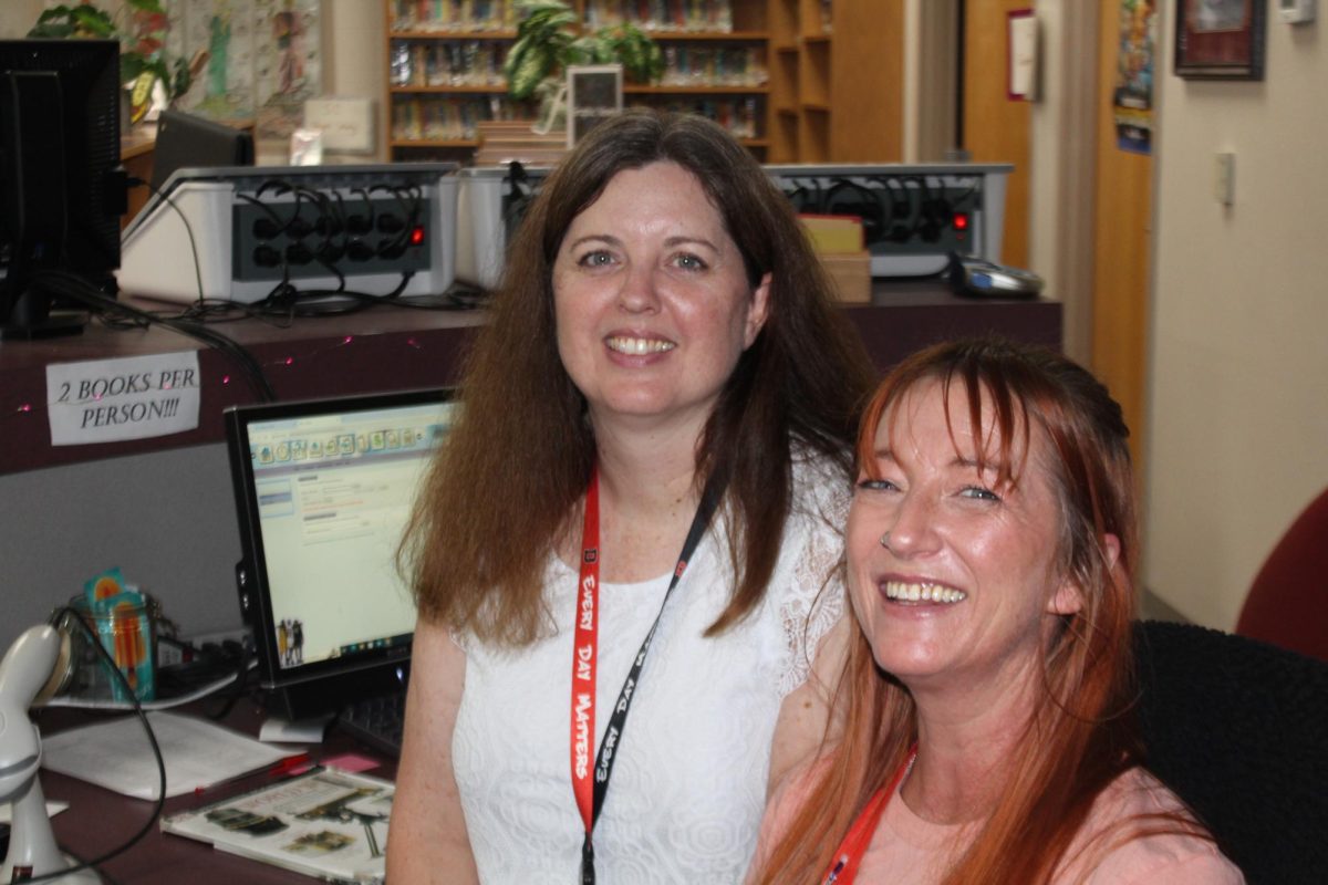 Librarian Barbara Gee and library assistant Rochell Mumford pause during the Chromebook rollout at the end of August.