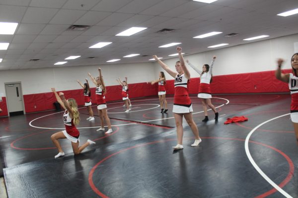 Duncan Middle School cheerleaders practice a cheer during seventh hour practice.