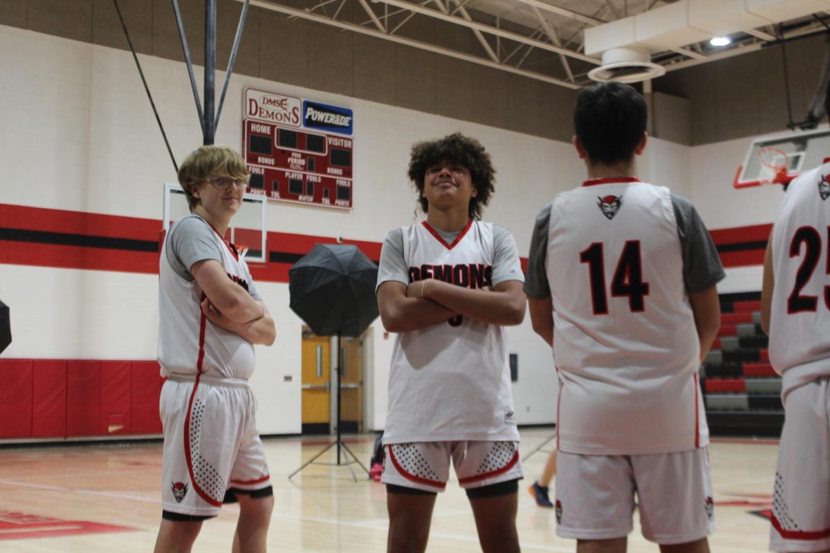 Duncan Middle School seventh-grade basketball players prepare to take their group photo for the yearbook.