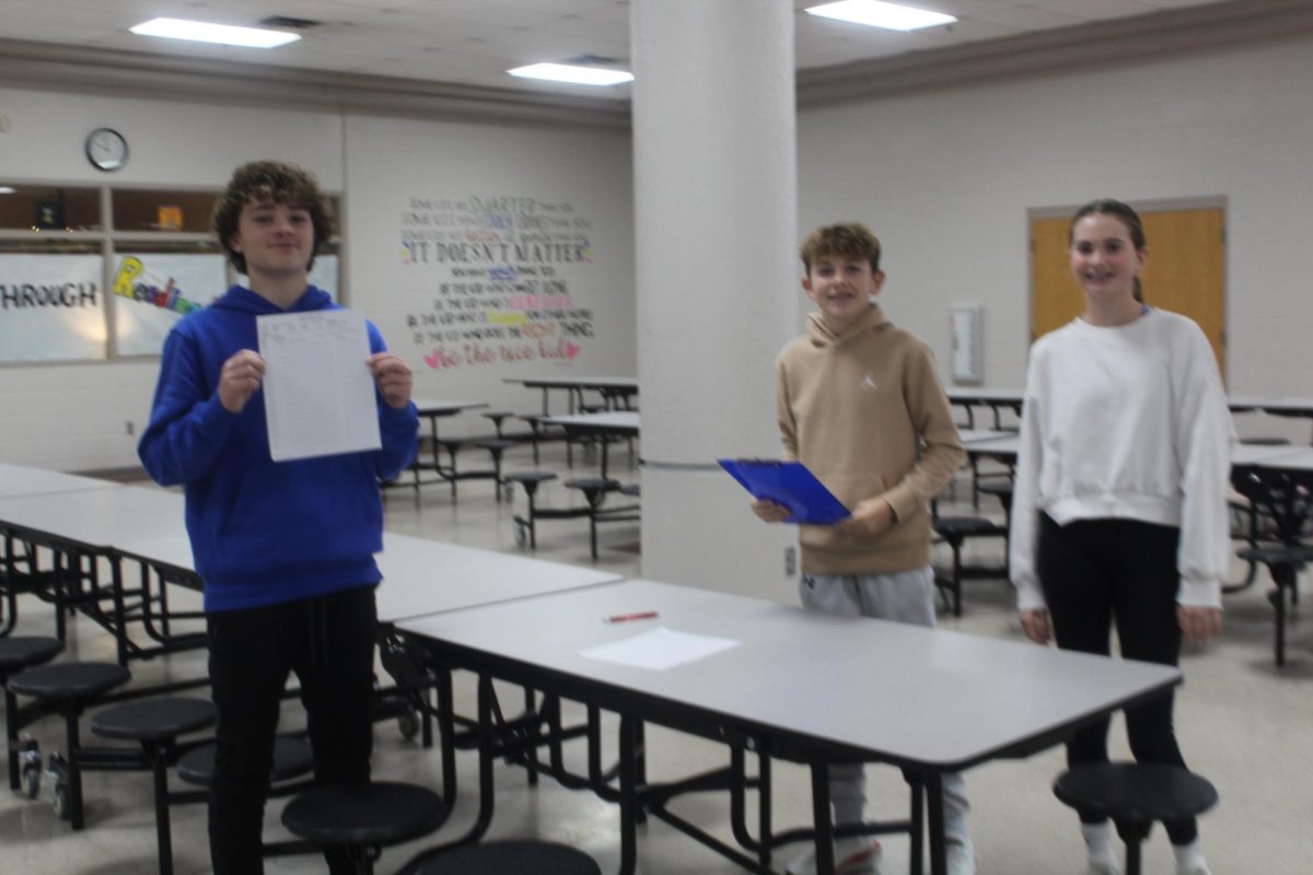 NJHS members help to sign blood donors up for the blood drive.