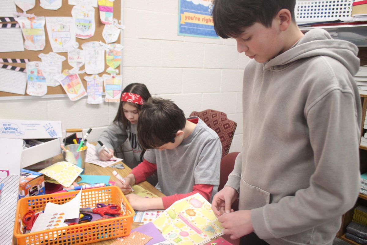 Sixth-grade students in Kerry Wilson's honors English class create Valentine's Day cards.