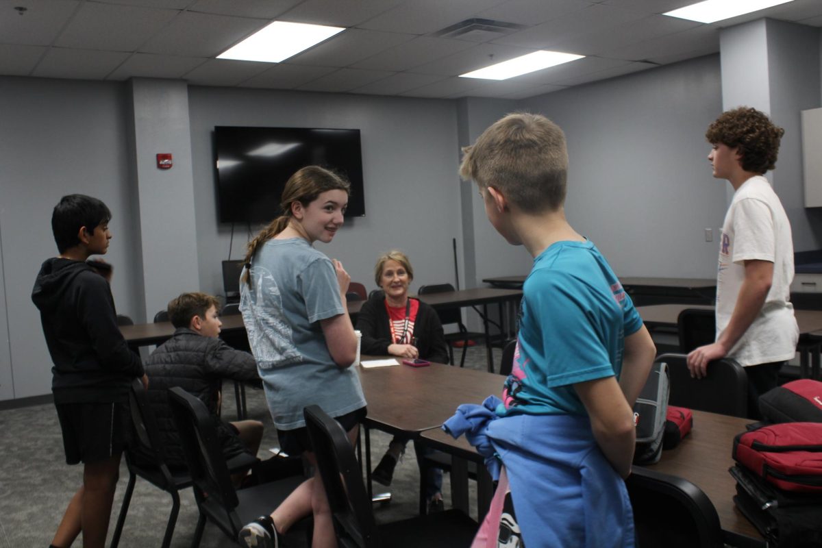 MathCounts team members get a briefing about the state competition from adviser Stacy Smith.