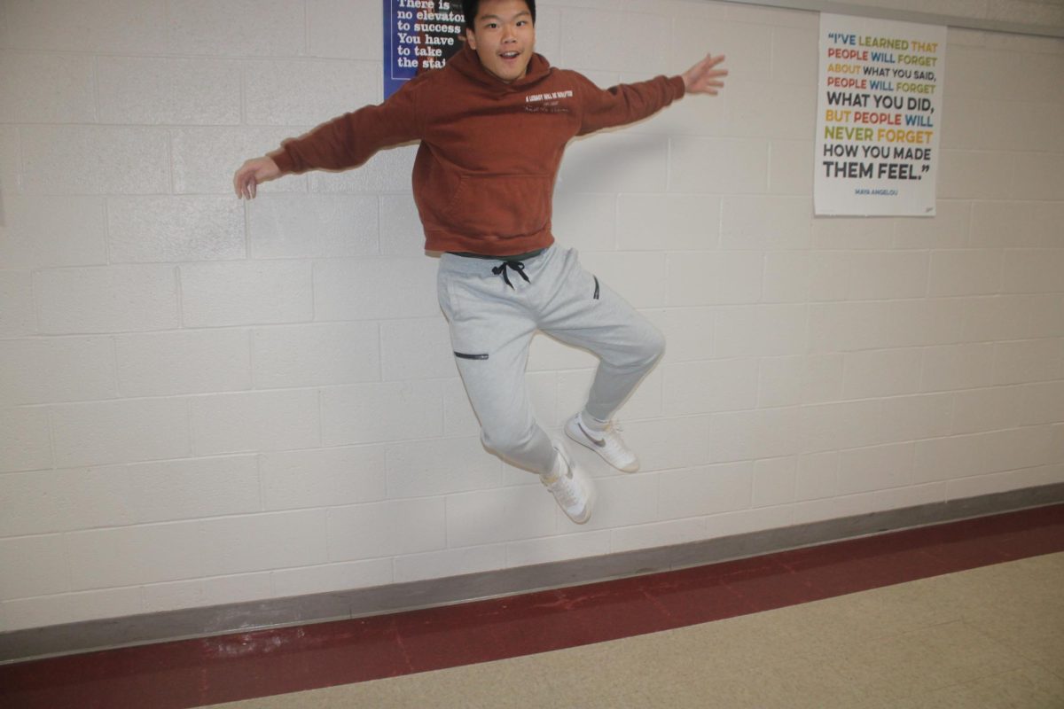 Peng Zhang jumps in excitement for the results of the Super Bowl.