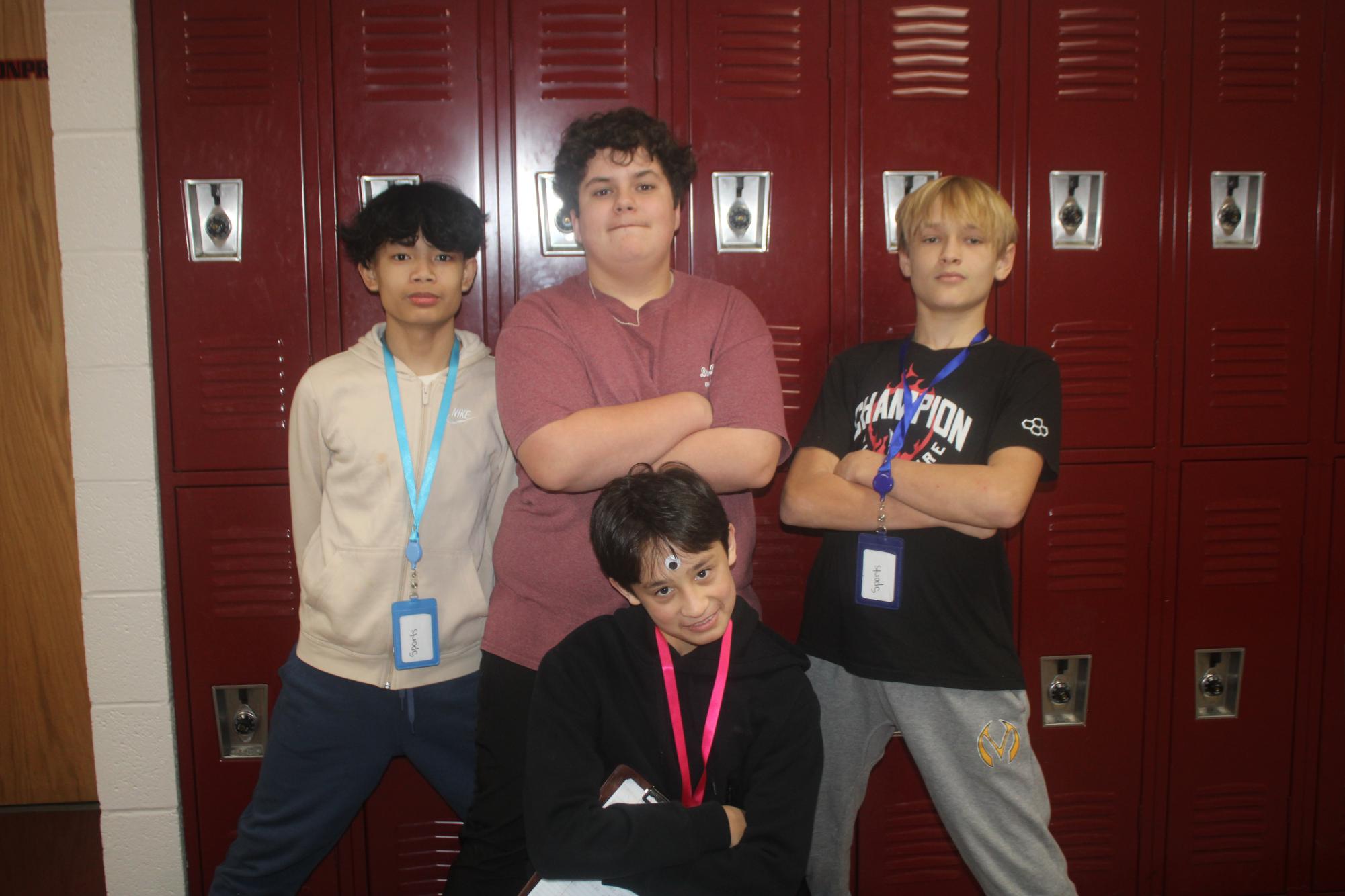 Staff members for newspaper and yearbook pose for a photo.