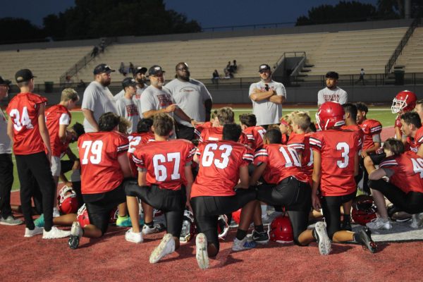 Eighth-grade football players huddle up during the game against Lawton Ike on Tuesday.