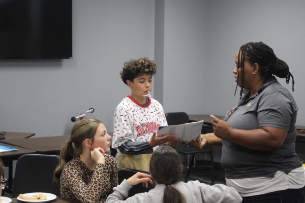 Eighth-grade students meet for a Youth Coalition meeting during their lunch time.