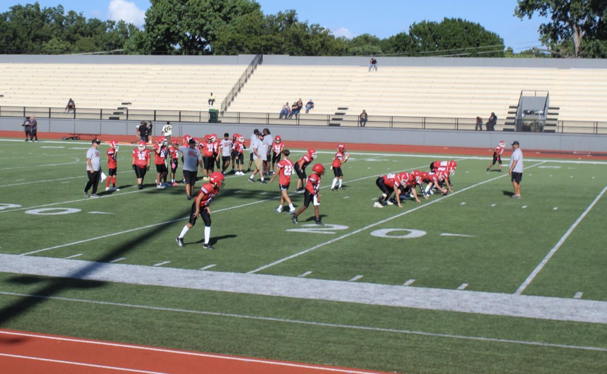 Duncan Middle School football players line up at the line of scrimmage Tuesday.