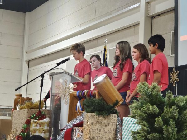 Student Council President Huck Petersen, along with other Student Council members, give a speech during the Oklahoma Association of Middle Junior High Student Councils state conference.