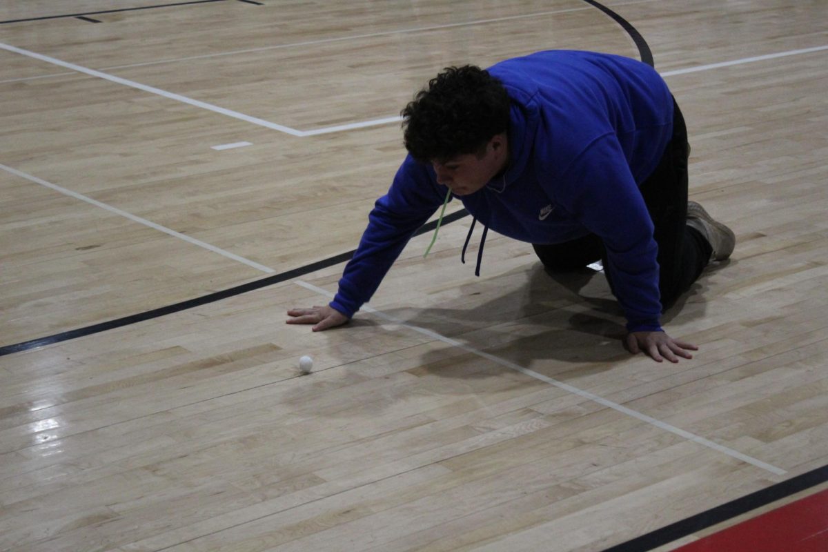 JG Gdanski blows a marshmallow across the gym floor, giving eighth-grade its only win.