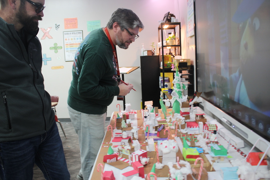 Mark Monteith and Derrick Miller vote on their favorite Christmas village.