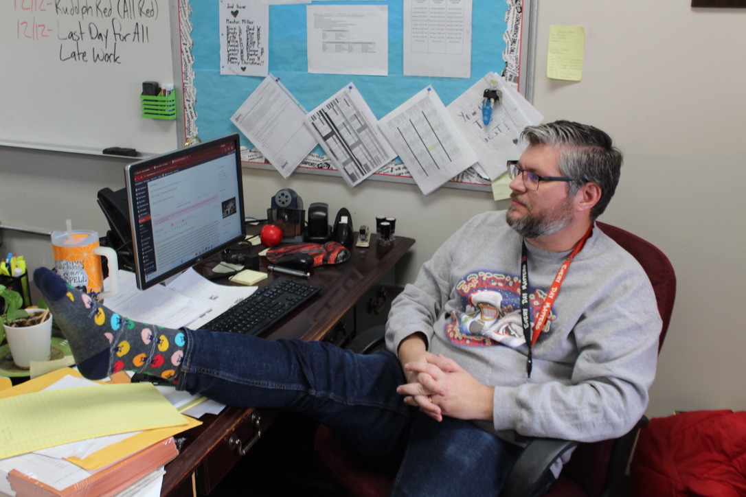 Derrick Miller shows off his Christmas socks during Christmas Crashout at DMS.