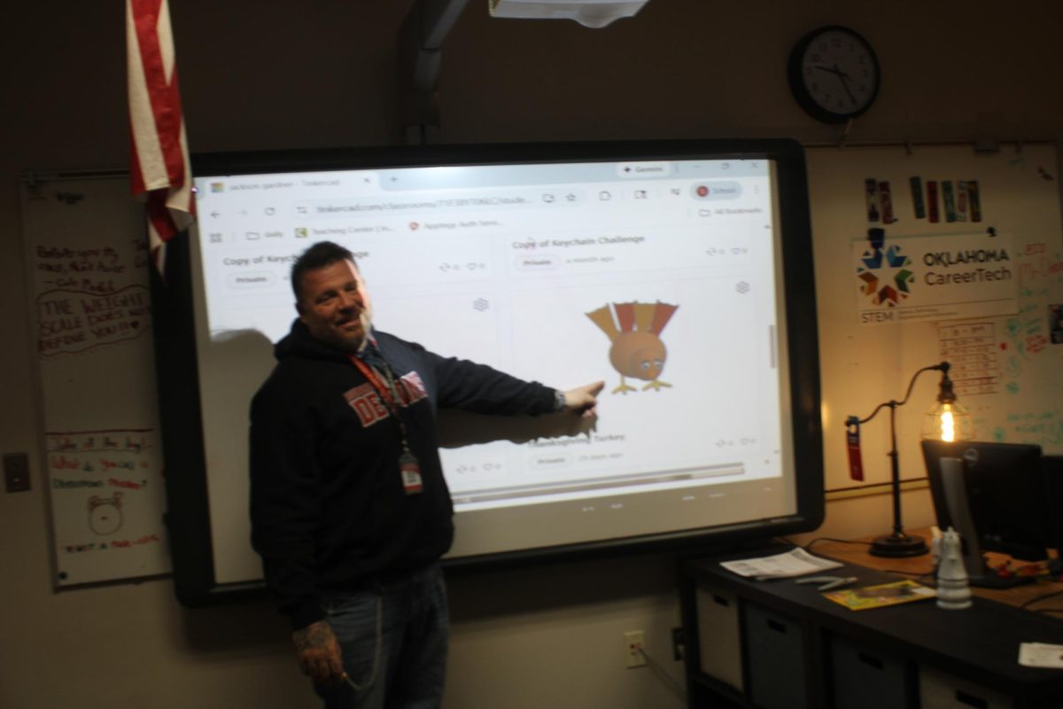 Steven Dixon teaches using his SmartBoard in his classroom.