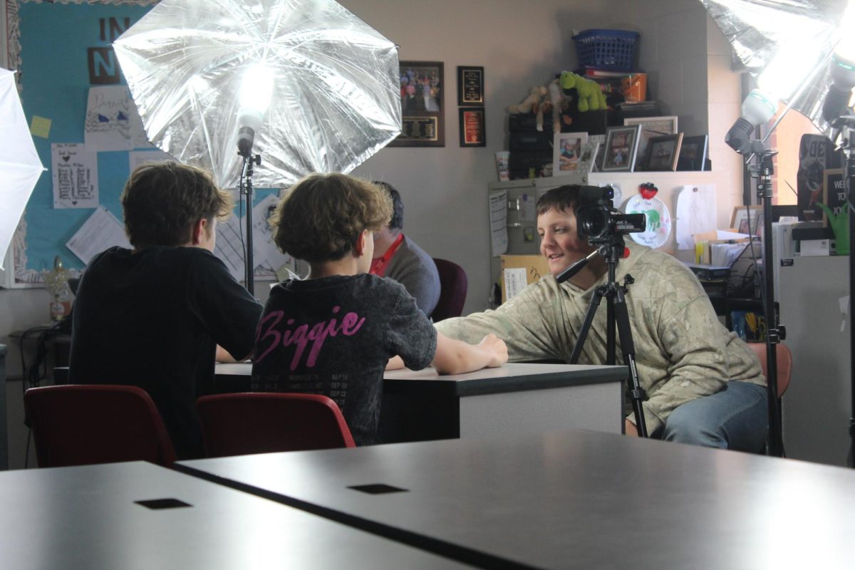 Demon Direct staff members prepare for today's News Update video.