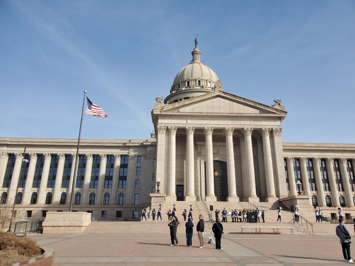 People gather in front of the Oklahoma State Capitol building.